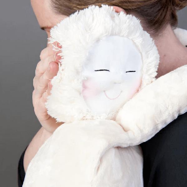 A sensory pet being hugged by a person 