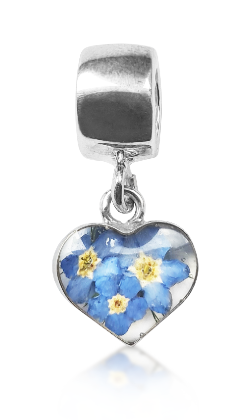 a heart charm with forget-me-nots inside