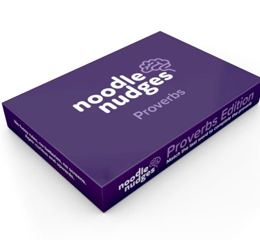 Noddle nudges proverbs game box on a table