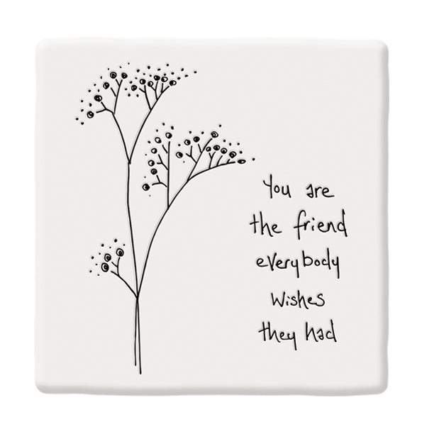 A square coaster with flower design and message &#39;you are the friend everyone wishes they had&#39; on a white backdrop