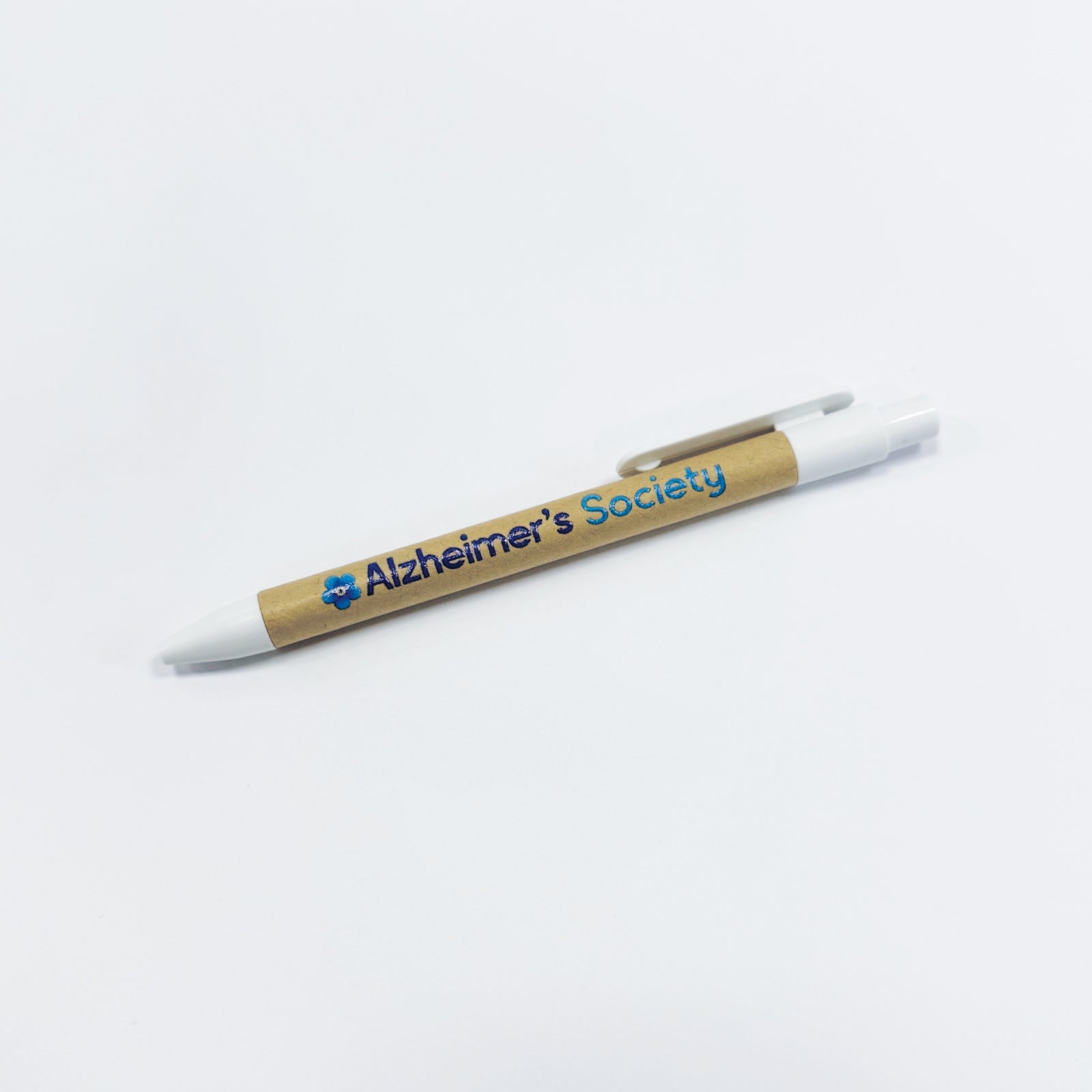 White Alzheimer's Society ballpoint pen with recycled cardboard barrel and blue flower logo and name