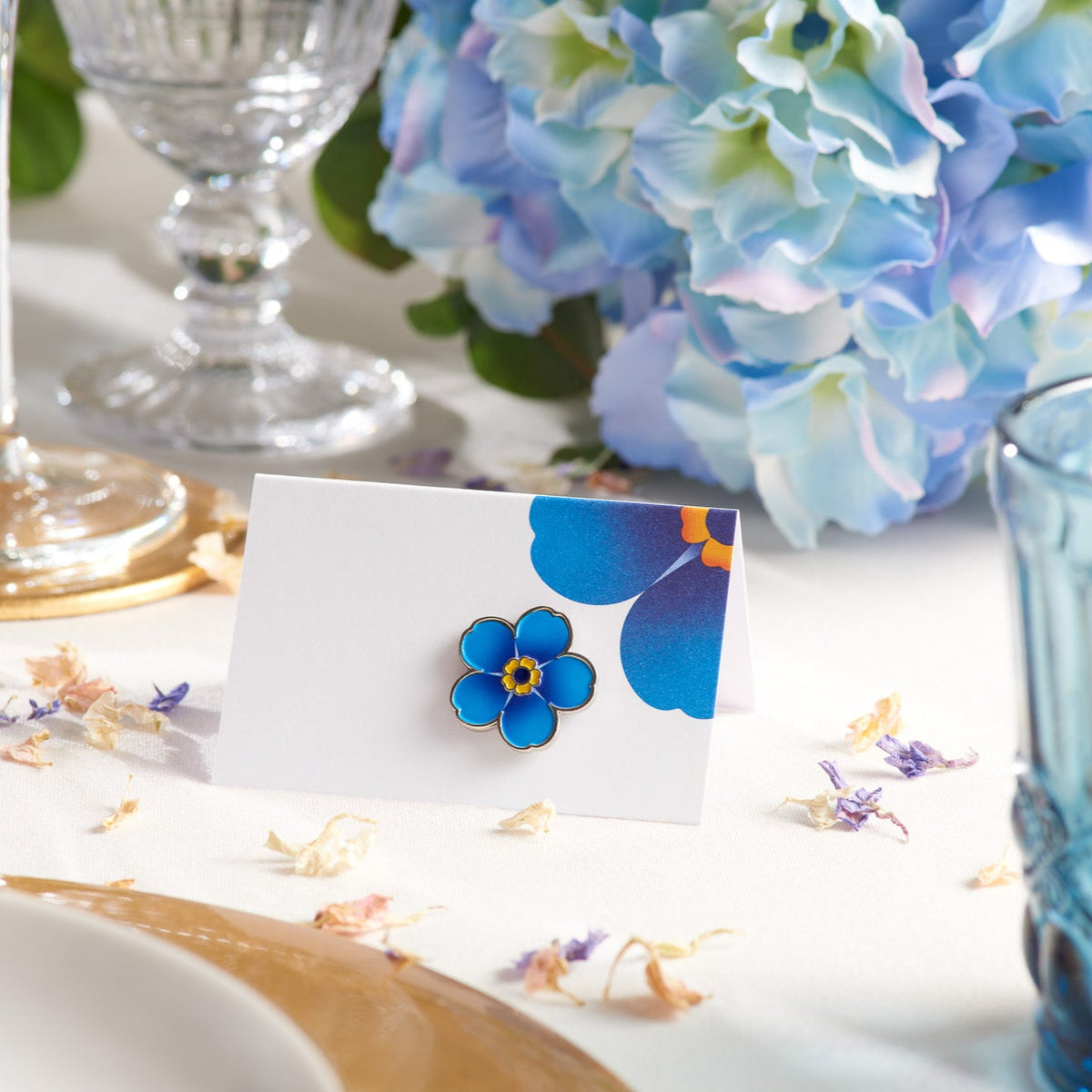 Alzheimer&#39;s Society enamel flower favour pin on a table card