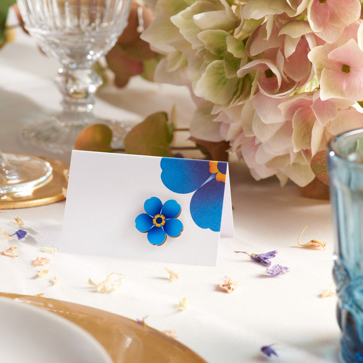 Bamboo Alzheimer&#39;s Society flower favour pin on a table card