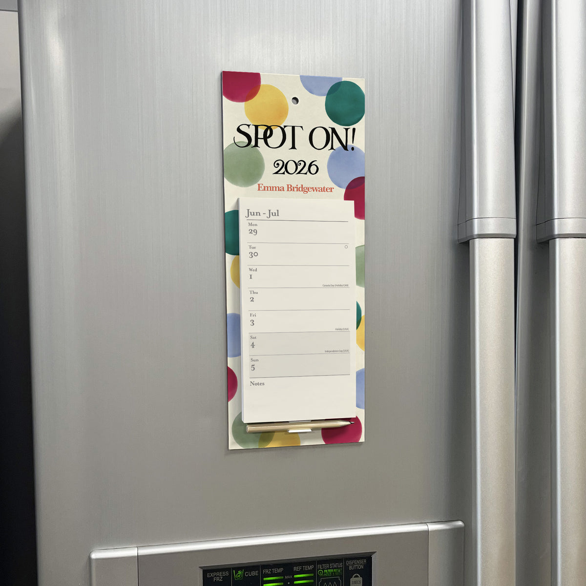Magnetic calendar on a refrigerator with colorful design
