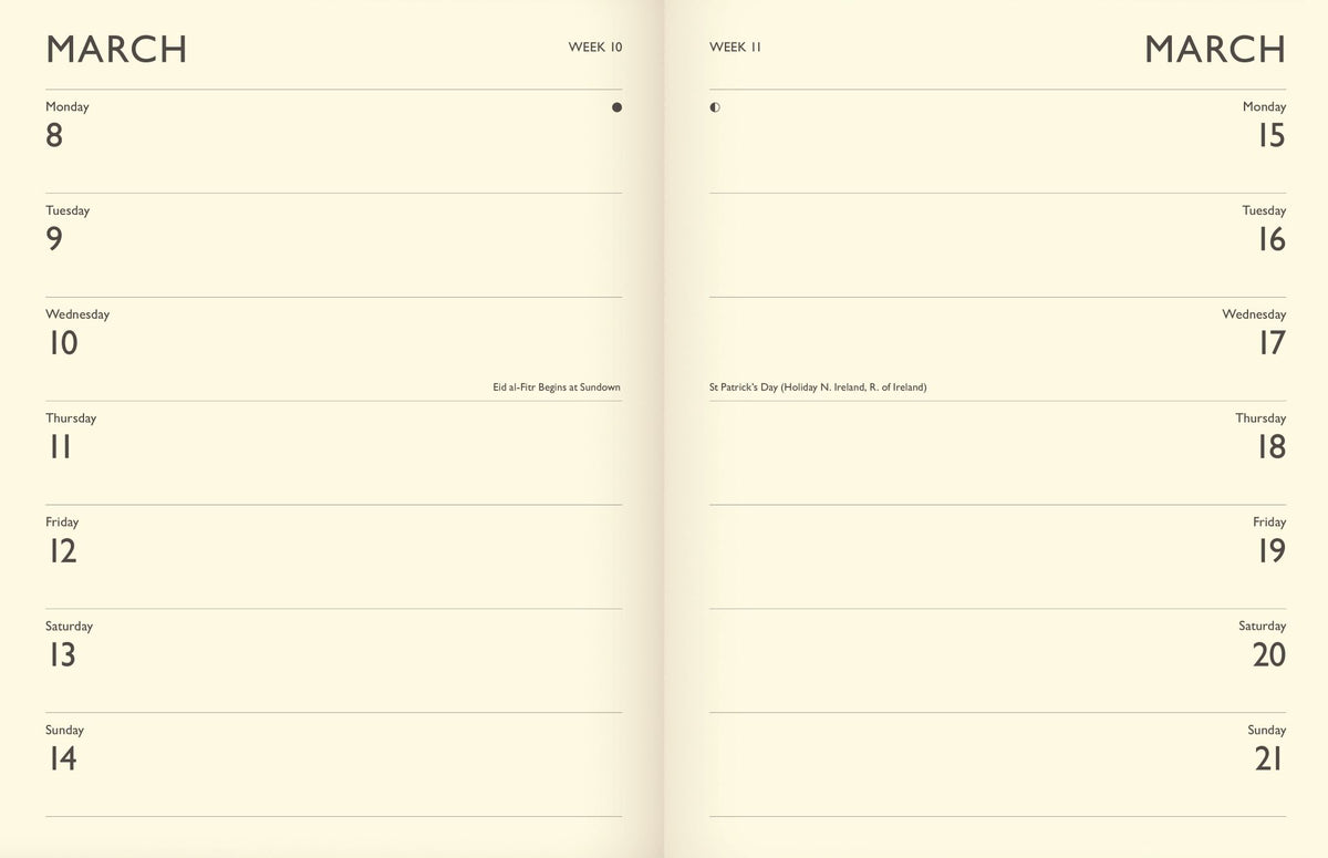 An open planner or notebook spread showing a minimalist monthly calendar layout for March, with cream pages and black text.