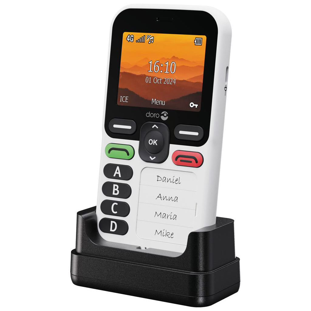 Small 4 button mobile phone for ease of use sat in charging cradle