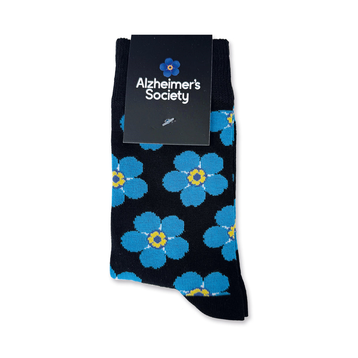 Blue Forget-me-not flowers on a black ankle sock - folded pair with cardboard header saying 'Alzheimer's Society' on a white background