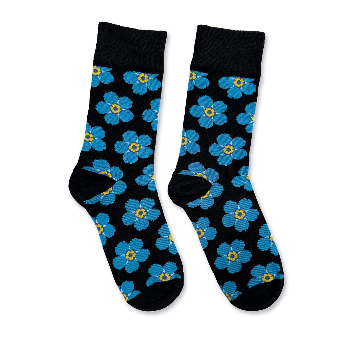 Blue Forget-me-not flowers on black crew socks on a white background