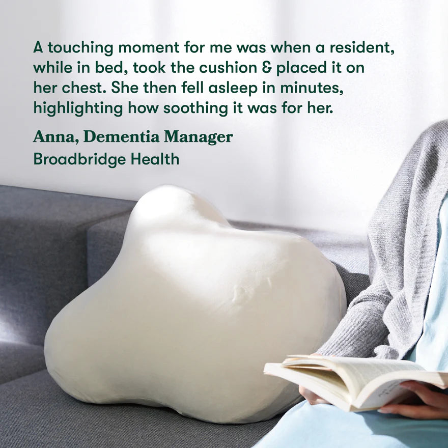 Person reading a book with a cushion on their chest, with text about a dementia manager's experience.