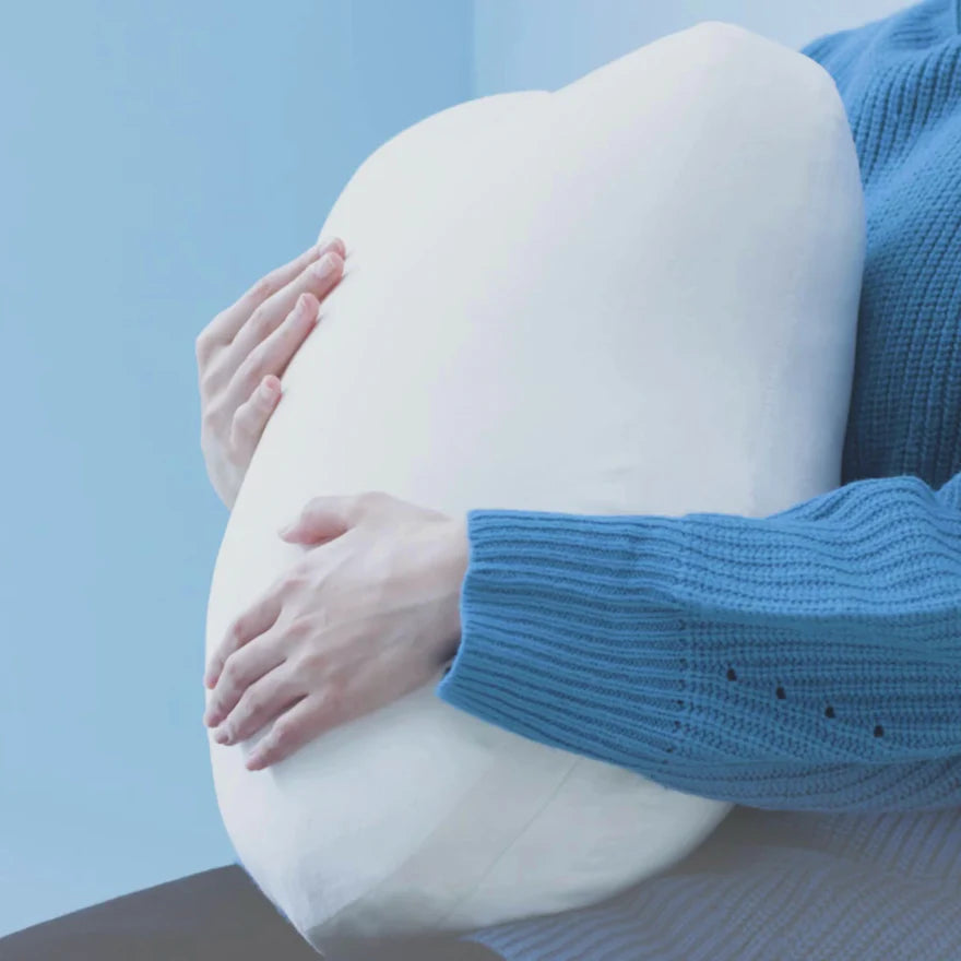 Fufuly calming cushion with arms embracing it.