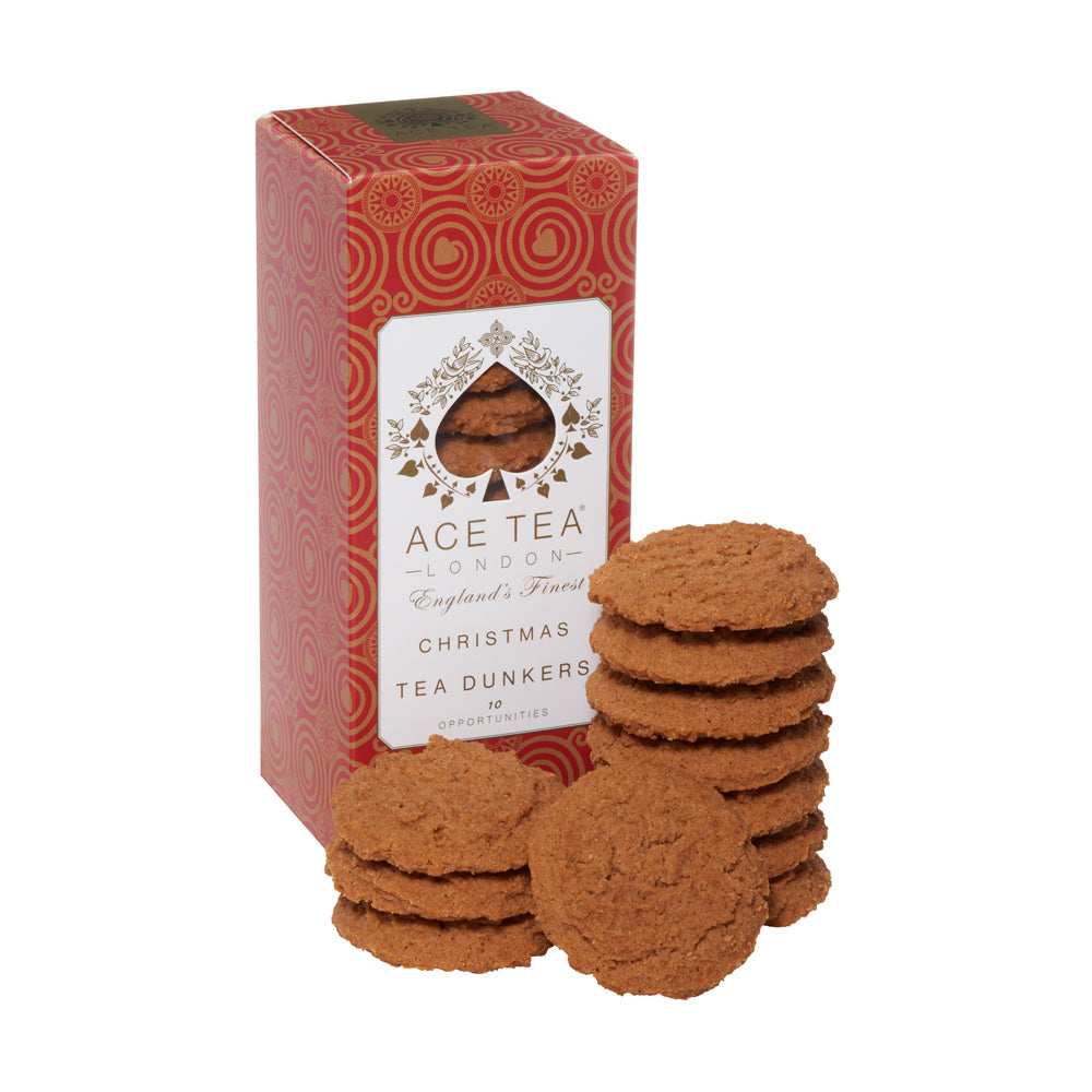 Stack of cookies in front of a red box labeled 'Ace Tea London Christmas Tea Dunkers' on a white background