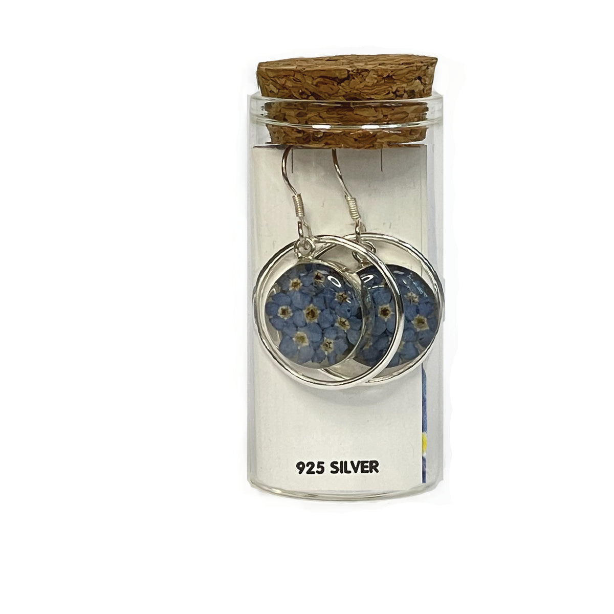 Forget-me-not silver circle earrings, on a white card, presented in a keepsake glass bottle with a cork lid.