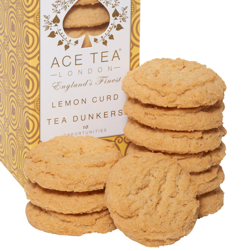 Stack of lemon curd tea dunkers with a box labeled &#39;Age Tea London&#39; on a white background