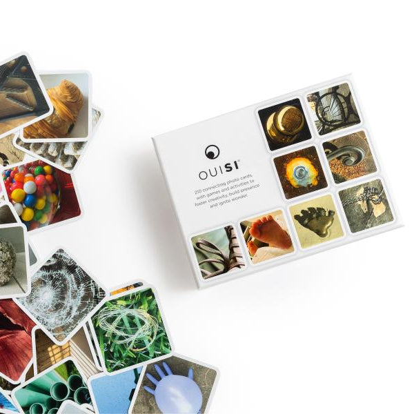Collection of small photographs displayed on a white surface with &#39;Ouisi&#39; branding.