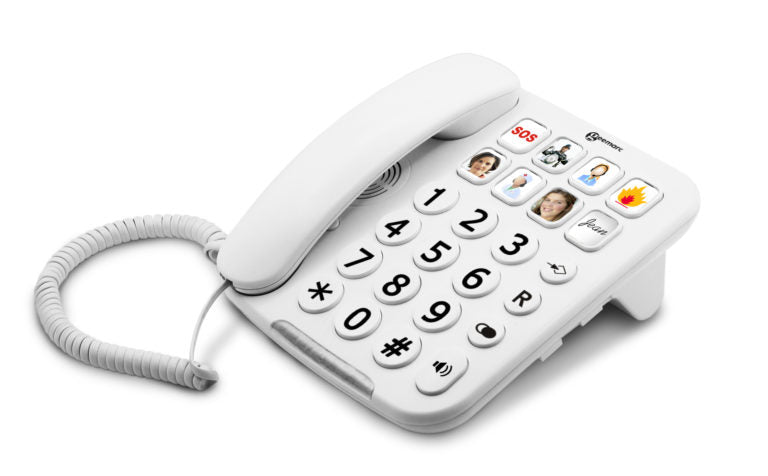 A white corded landline telephone with a numeric keypad, handset, and touch-style call buttons showing icons, photographed on a clean white background.