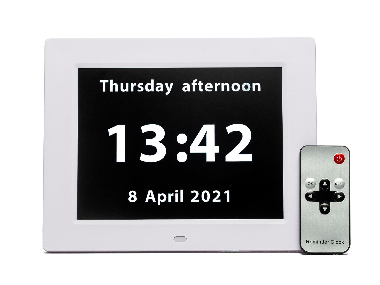 Digital clock with remote control displaying time and date on a white background
