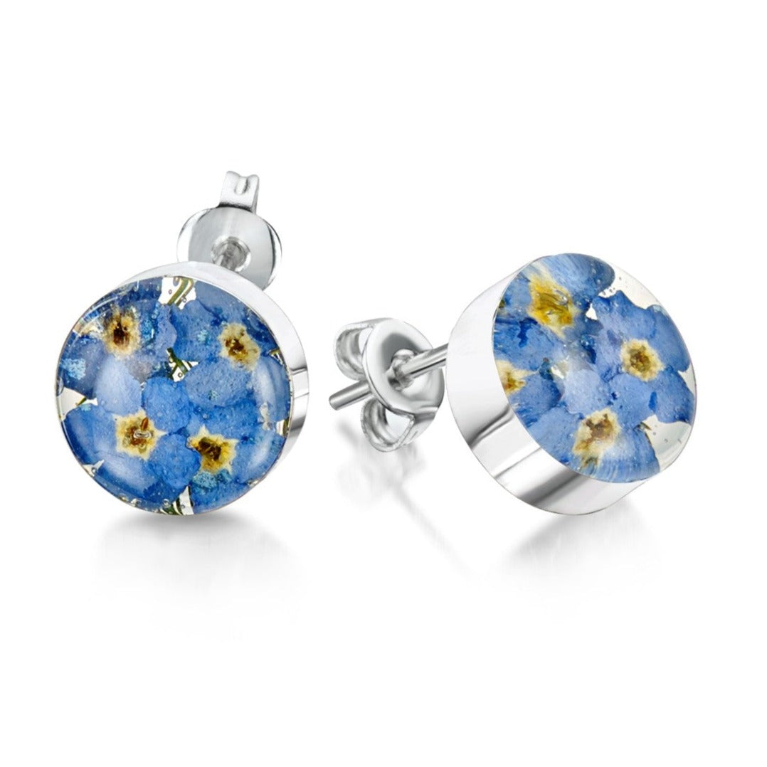 Sterling silver round stud earrings with real forget-me-not flowers set in resin. The earrings fasten with sterling silver butterfly backs
