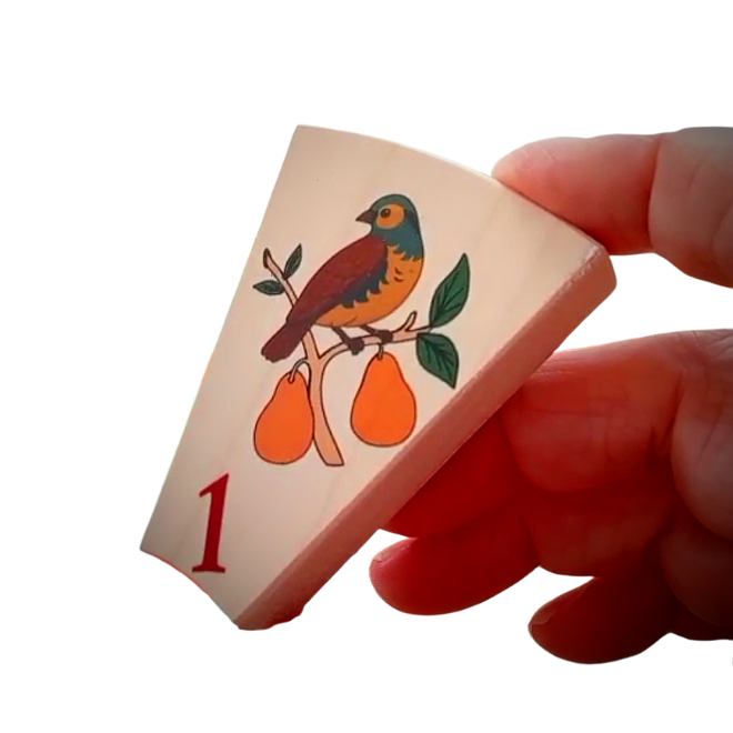 The twelve days of Christmas advent activity with partridge design. Single piece in a hand.