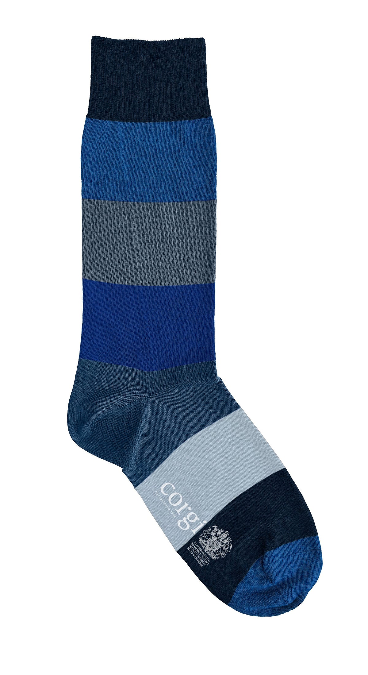 A single crew sock with horizontal stripes in navy, blue, gray, and light blue, featuring the brand name 'corgi' and the King's royal warrant printed on the light and dark blue section on the sock sole.
