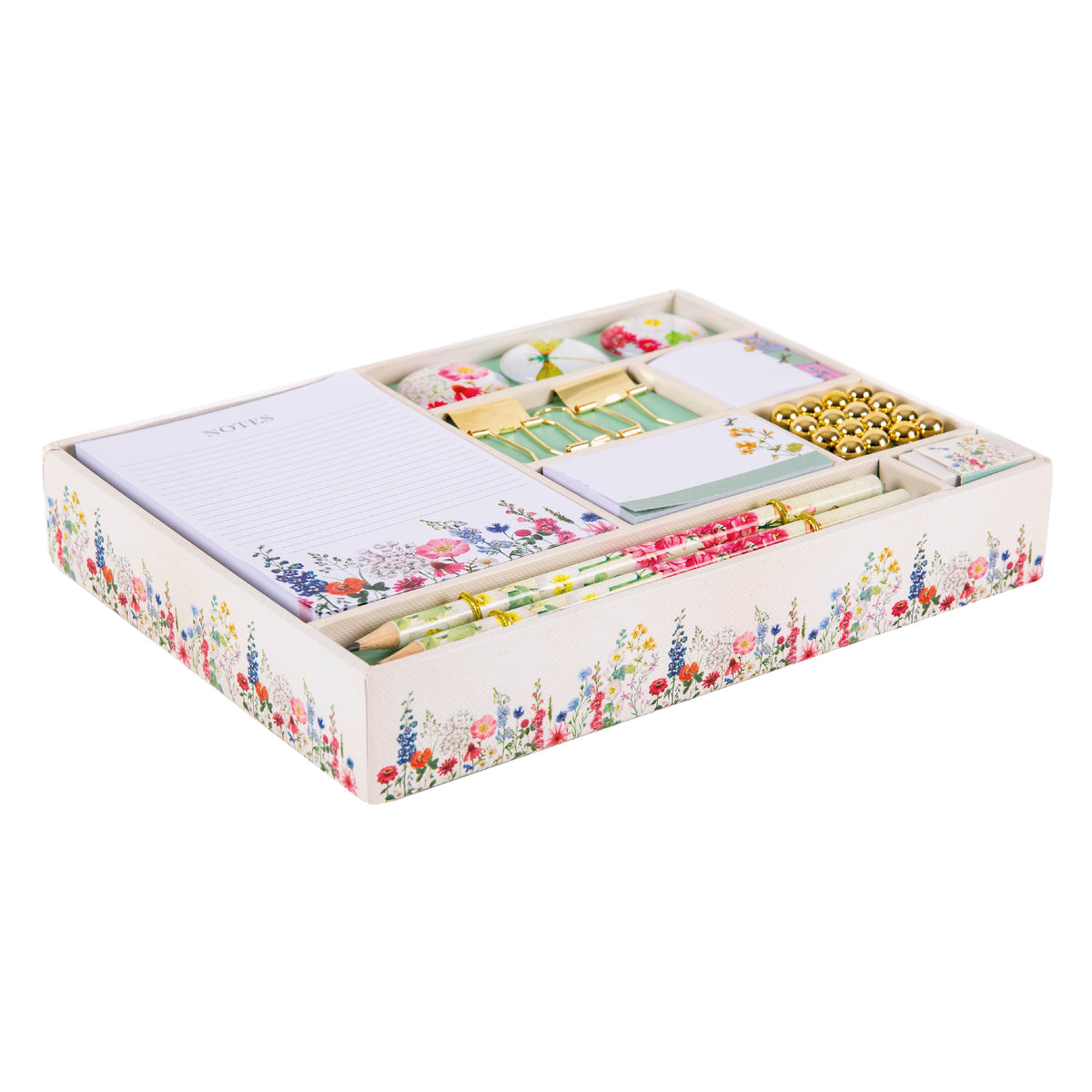 Stationery set with a notebook, pens, and decorative and practical items in a green and cream box.