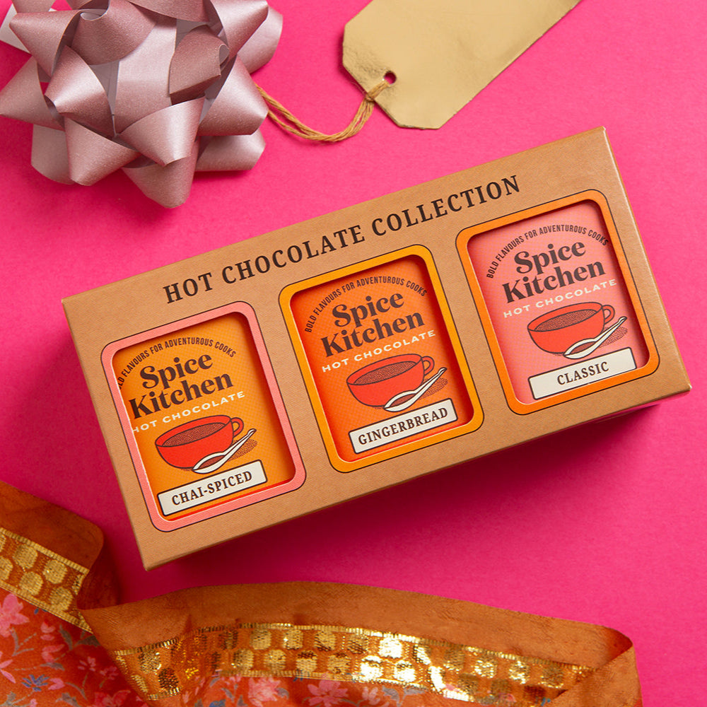 Hot chocolate collection from Spice Kitchen in a box on a pink background