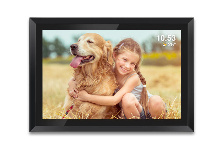 Digital photo frame displaying a picture of a girl hugging a dog in a field.