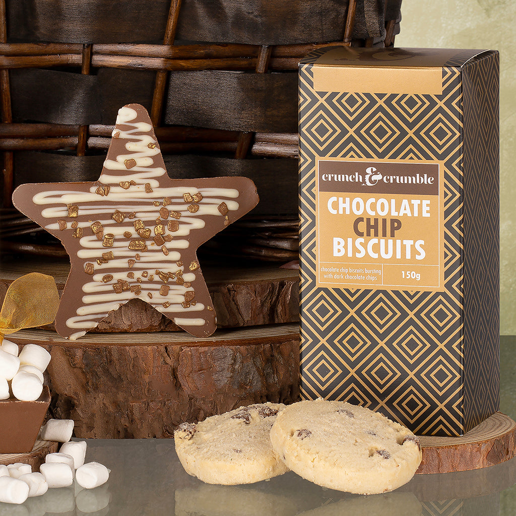 Star shaped chocolate and chocolate chip biscuits with a wicker basket in the background.
