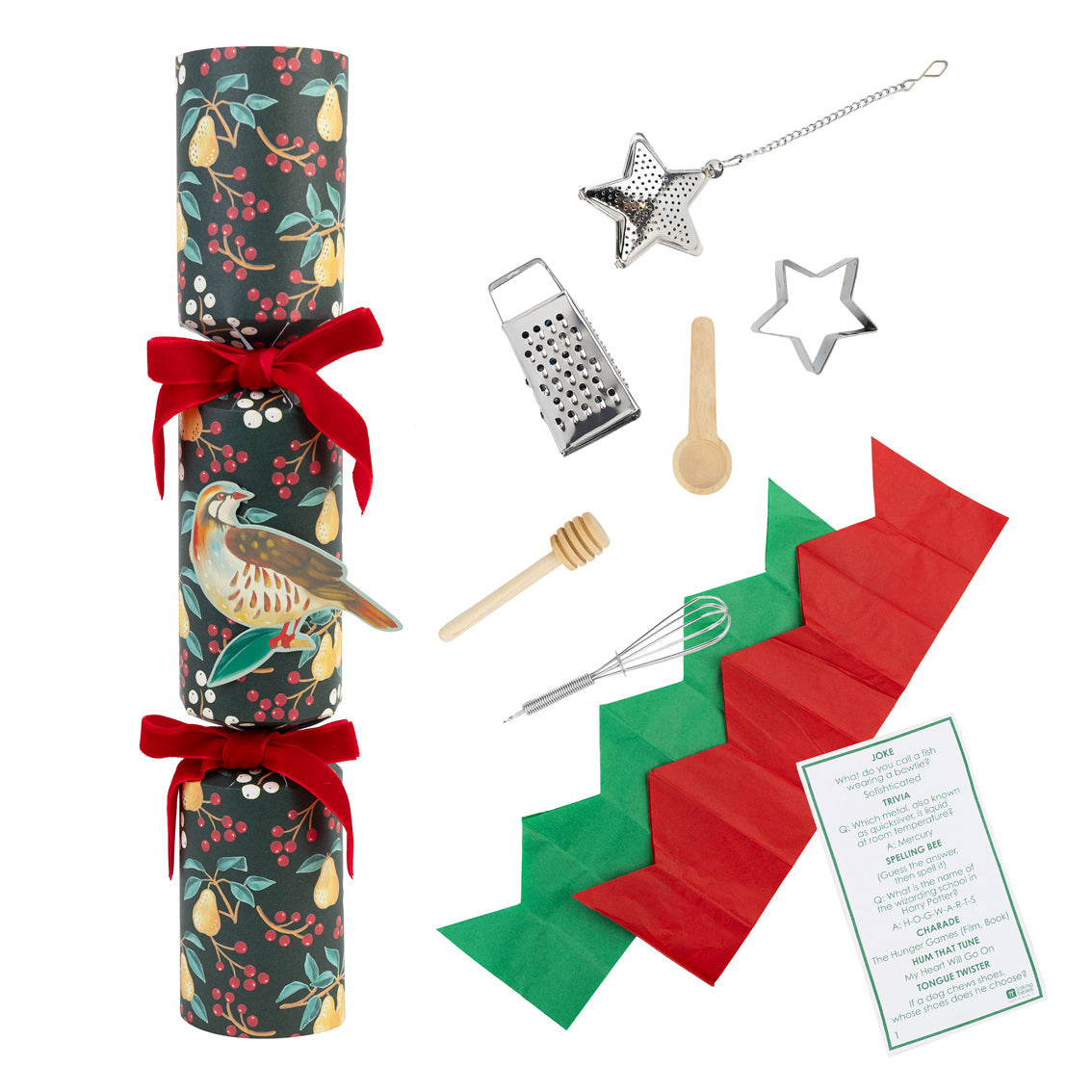 Collection of kitchen items including a cracker, grater, star-shaped cutters, and more on a white background.
