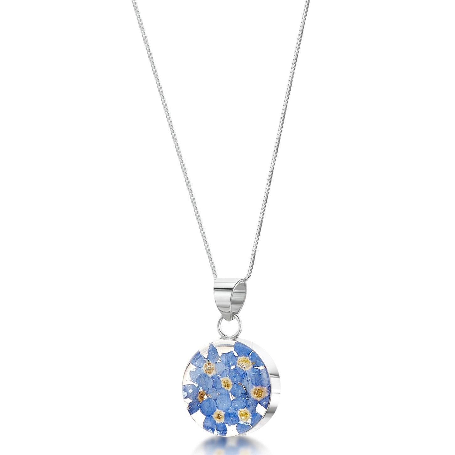 Sterling silver round pendant with real forget-me-not flowers set in resin. Hangs on an adjustable 18 inch sterling silver chain.