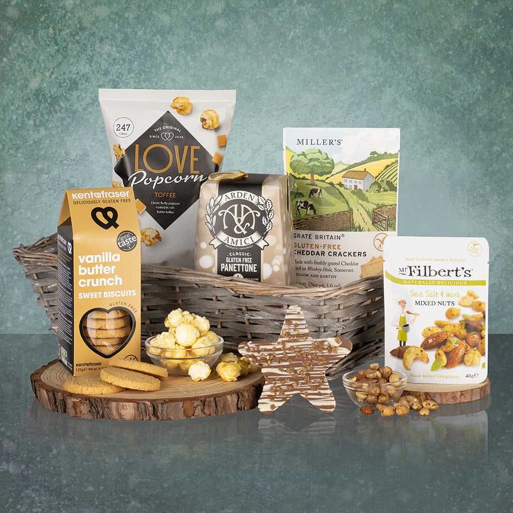 Gluten and wheat free themed gift set with hamper basket, food items, and a star-shaped cookie.