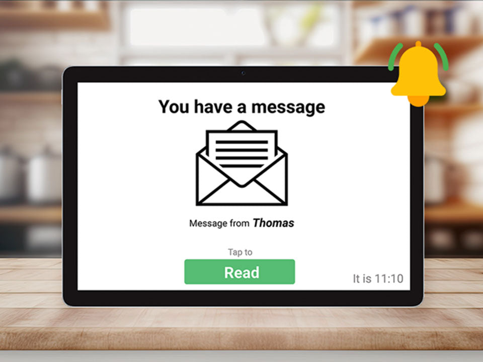 Digital tablet on a wooden surface displaying an email notification from &#39;Thomas&#39;.