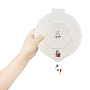Idem pill dispenser with white lid