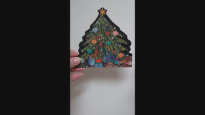 This video shows how the two parts of a Christmas tree card slot together to create a 3D card that stands up. One of the 4 side views shows the reverse of the card information and space for you to write. The greeting Merry Christmas is also printed on one of the side views.