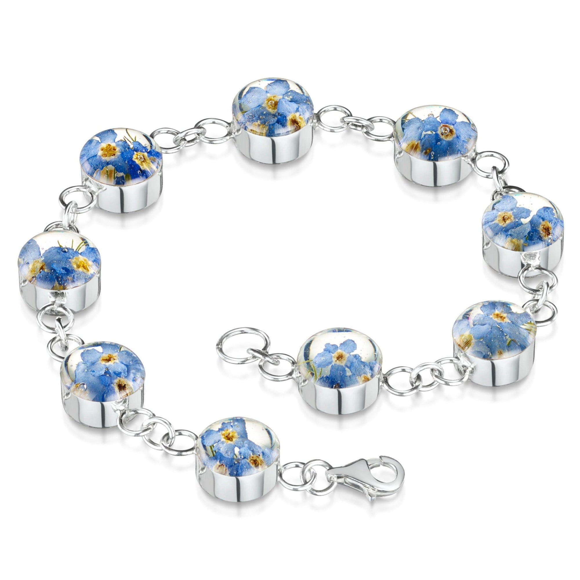 Sterling silver round bracelet with lobster clasp. Each of the nine round charms has real forget-me-not flowers set in resin.
