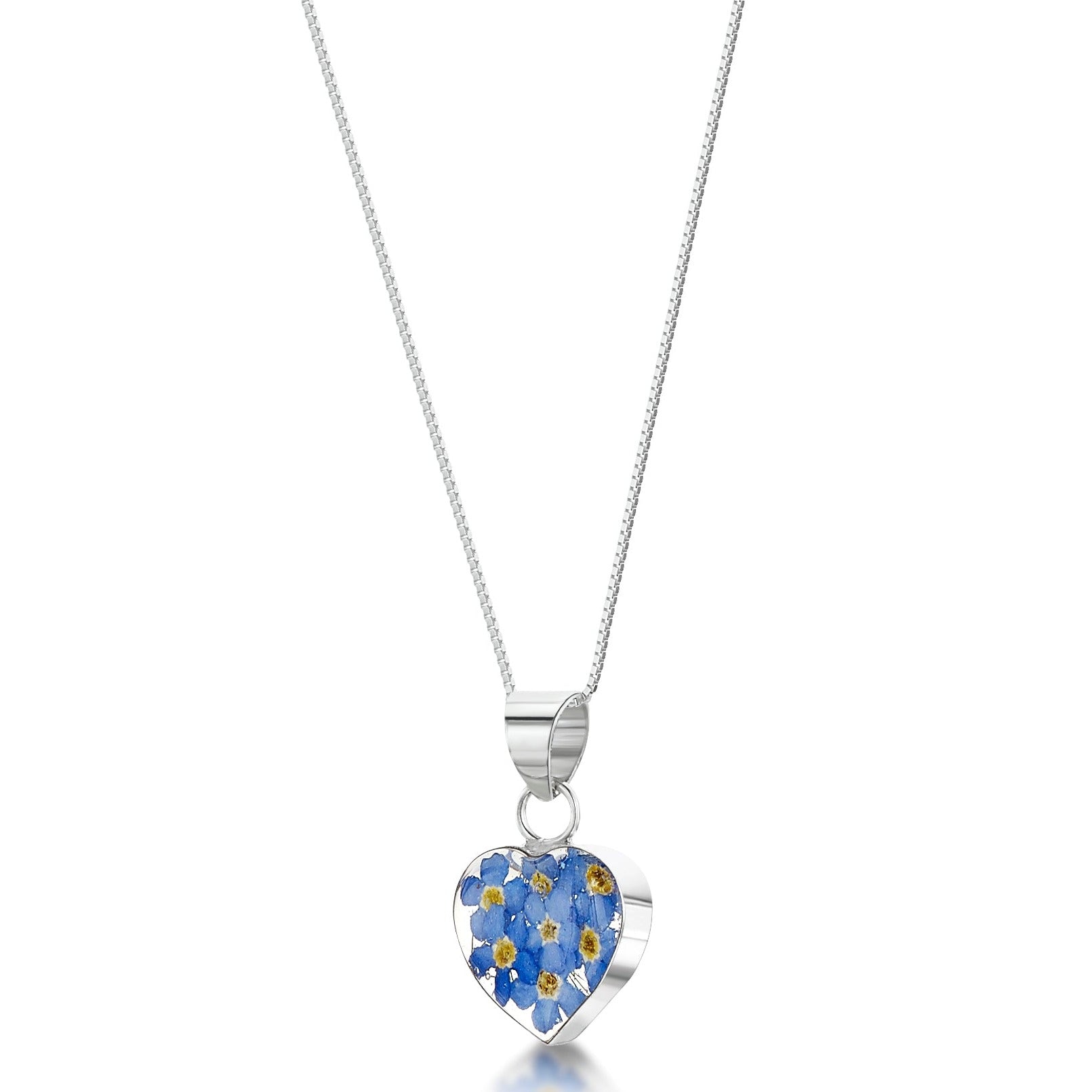 Sterling silver heart-shaped pendant with real forget-me-not flowers set in resin. Hangs on an adjustable 18 inch sterling silver chain.