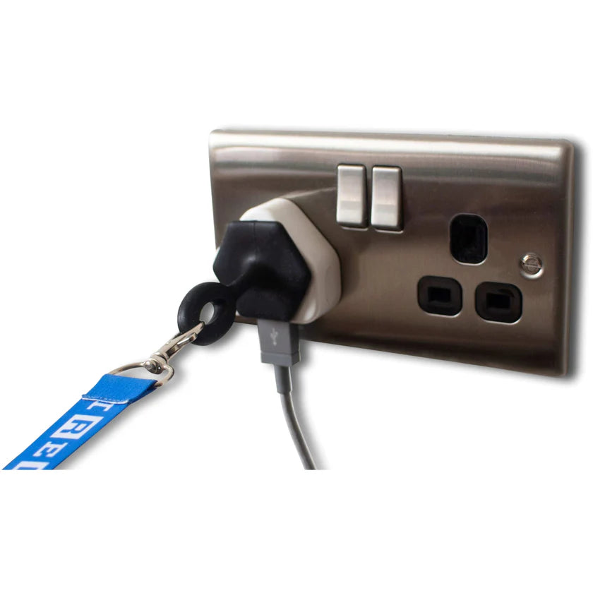 Metallic electrical socket with plugs and a black silicone grip handle stuck the plug with a blue lanyard clipped to it on a white background
