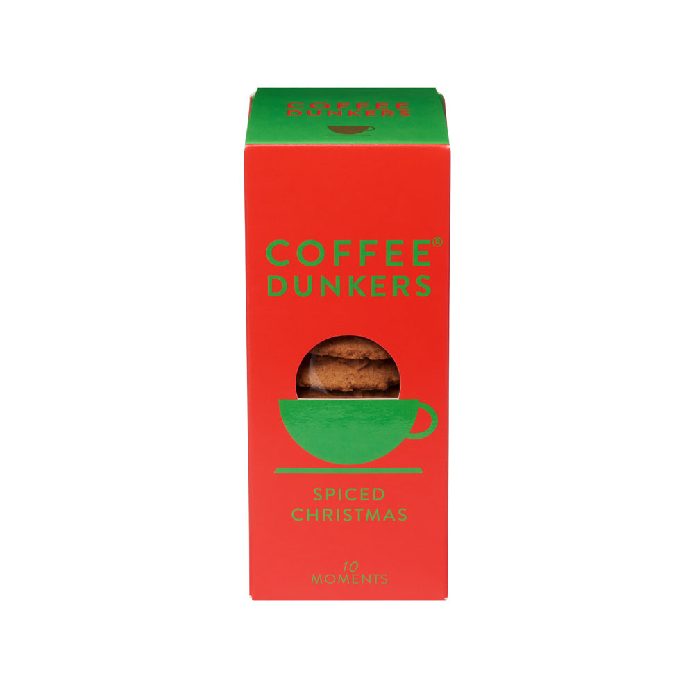 Red box of Coffee Dunkers Spiced Christmas cookies with green accents on a white background