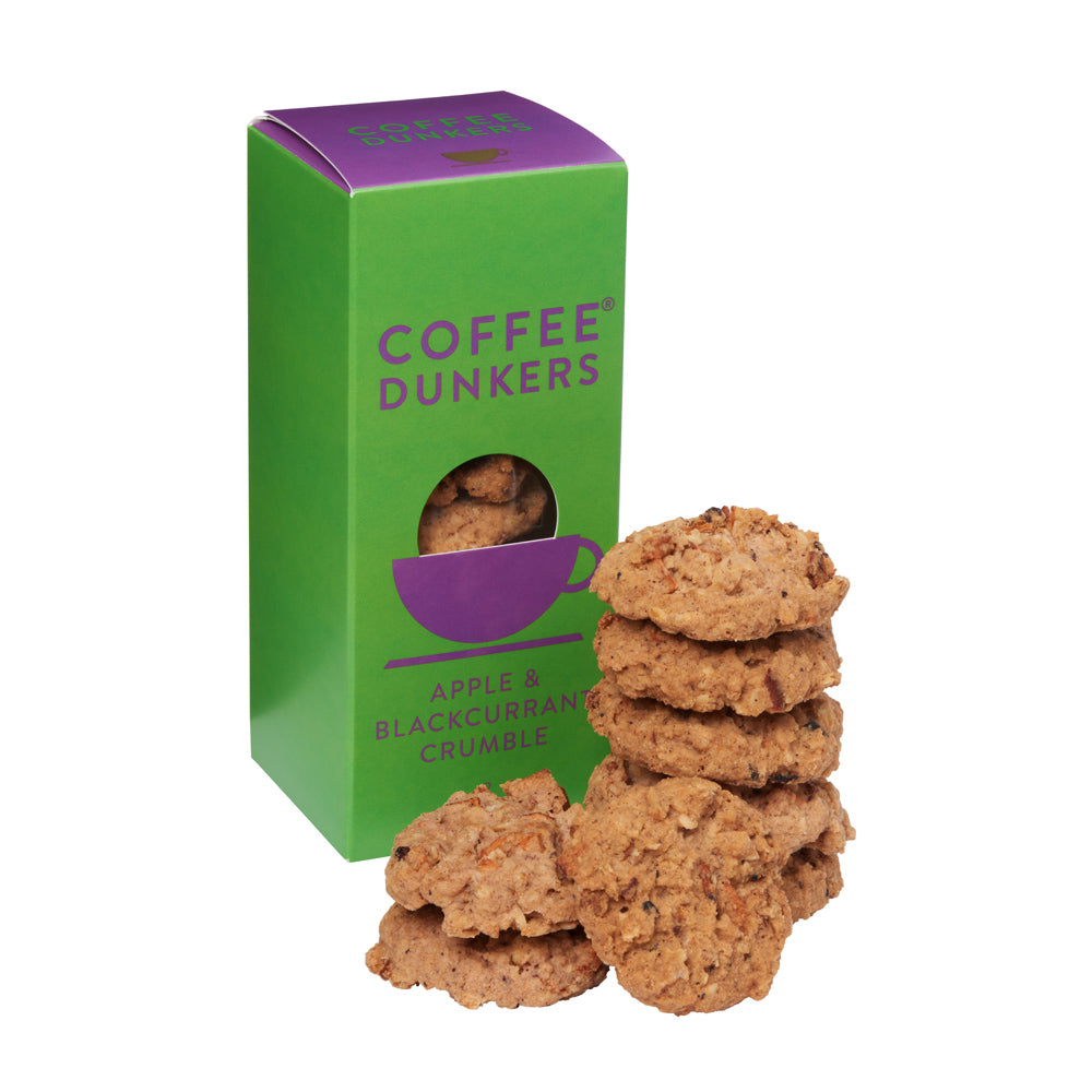 Stack of cookies in front of a green and purple 'Coffee Dunkers' box on a white background