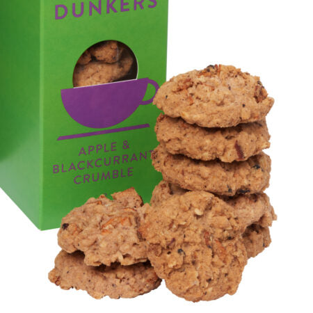 Stack of apple and blackcurrant crumble cookies with a green box in the background