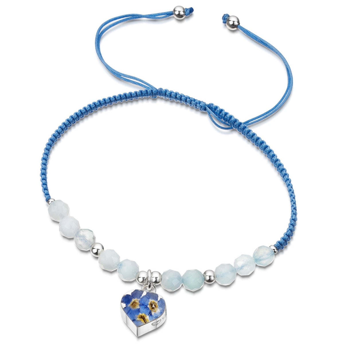 Handwoven, threaded bracelet of sky blue nylon with aquamarine beads, sterling silver beads and a  central sterling silver heart-shaped charm with real forget-me-not flowers set in resin.